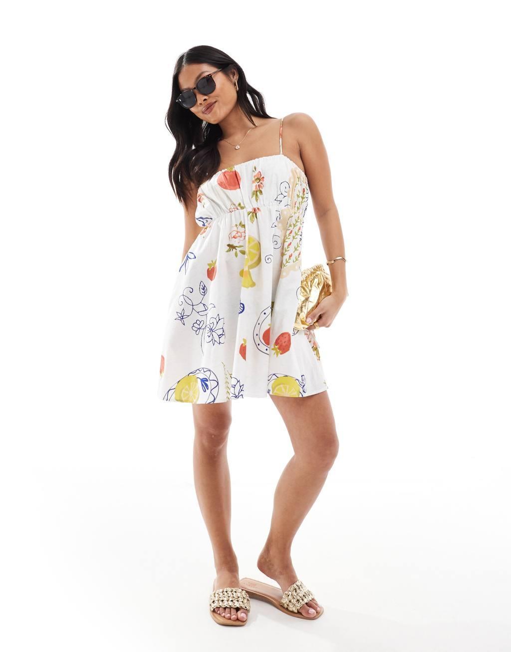 ASOS DESIGN Petite ruched bust mini sundress with adjustable straps in all over print Product Image