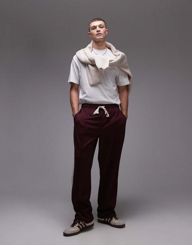 Topman straight leg sweatpants with side stripe in burgundy Product Image