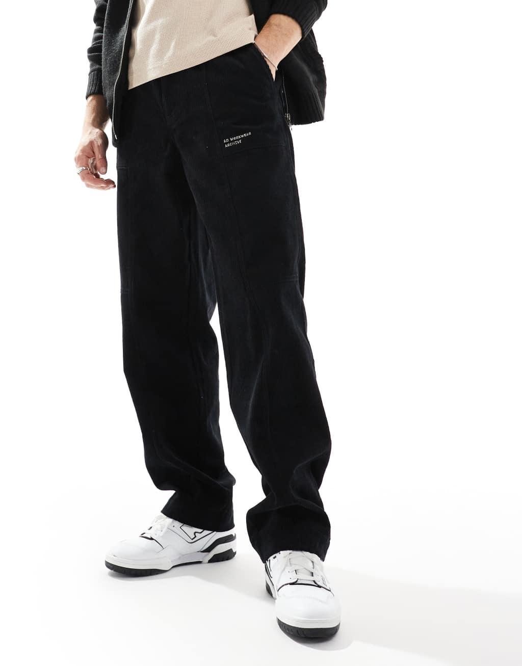 ASOS DESIGN baggy corduroy pants in black with embroidered patch Product Image