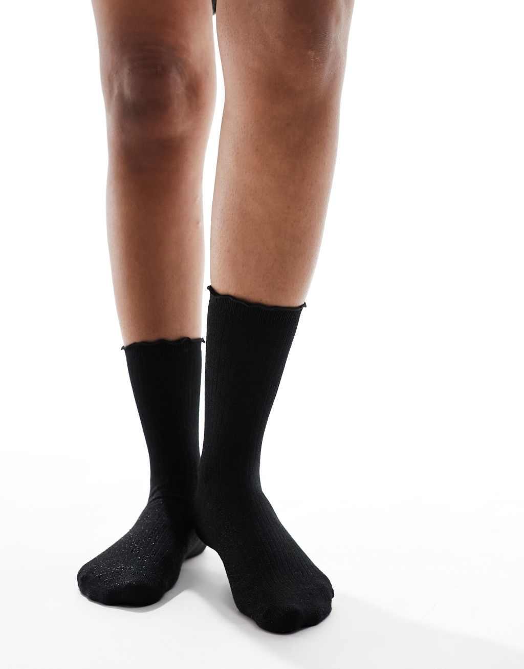 Vero Moda ribbed glitter sock with frill edge in black Product Image