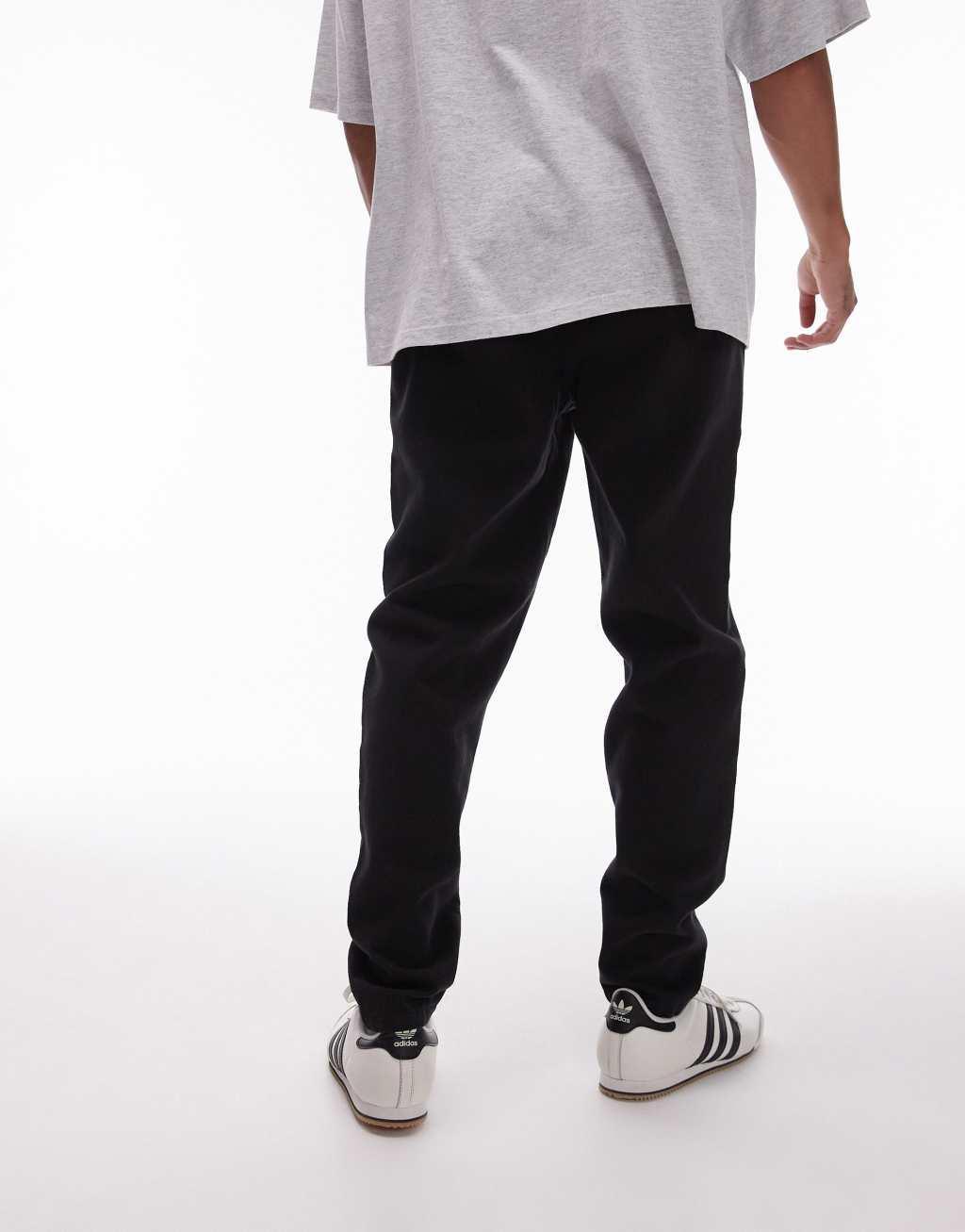 Topman tapered pants with elasticated waistband in black Product Image