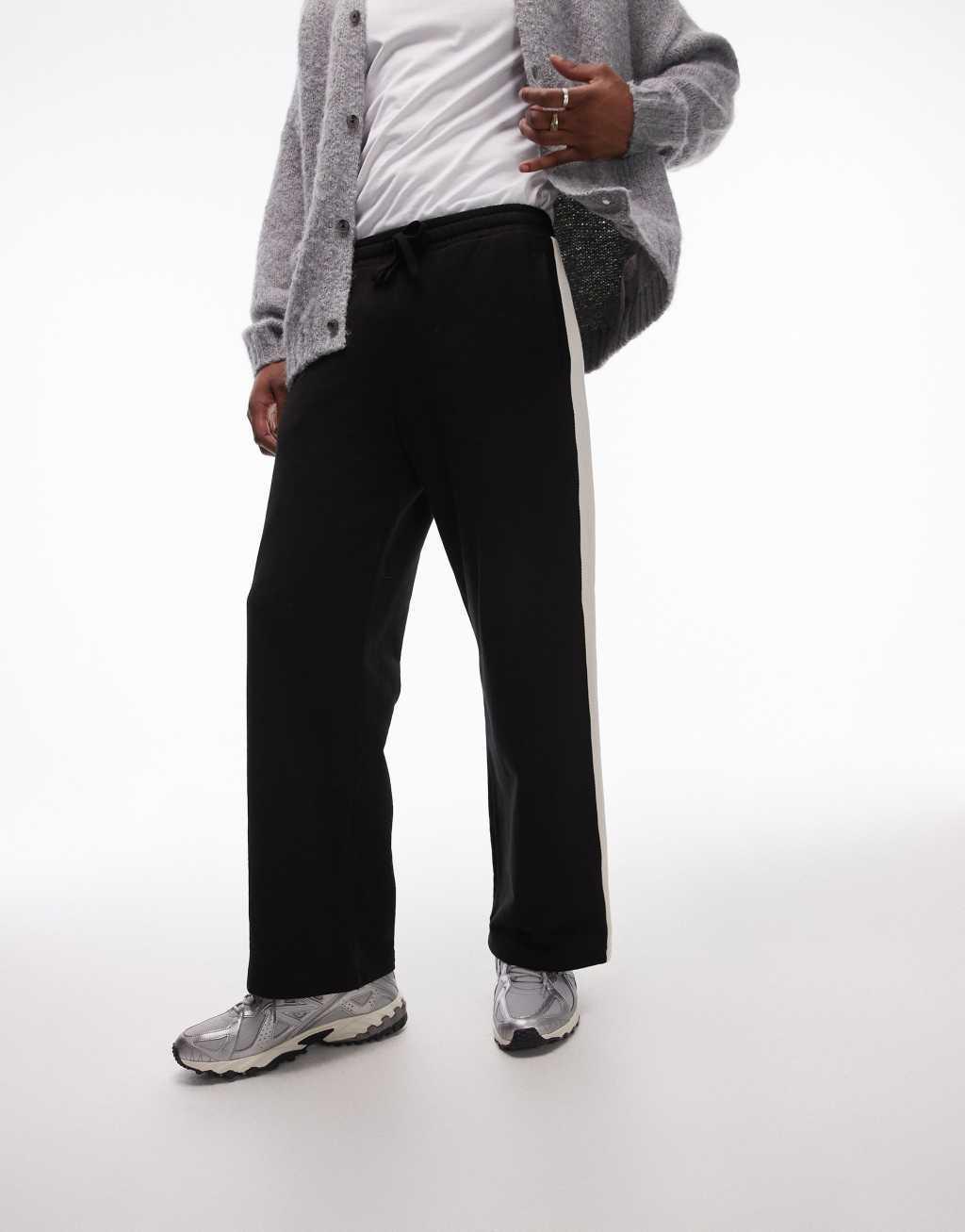 Topman baggy leg sweatpants with contrast side stripe in black Product Image