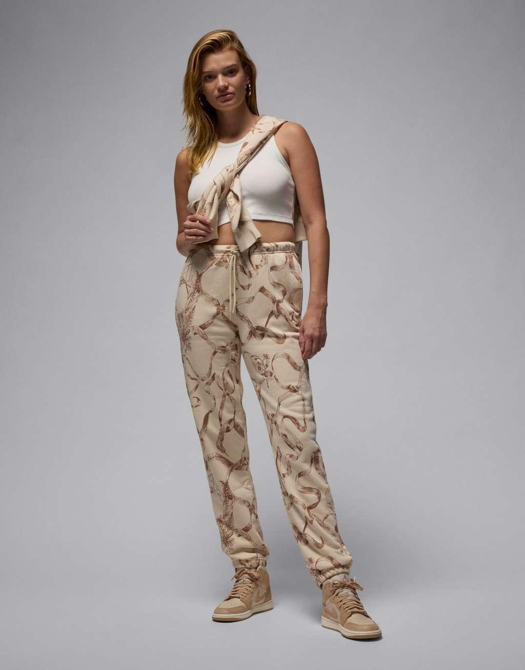 Jordan Brooklyn fleece all-over print sweatpants in brown Product Image