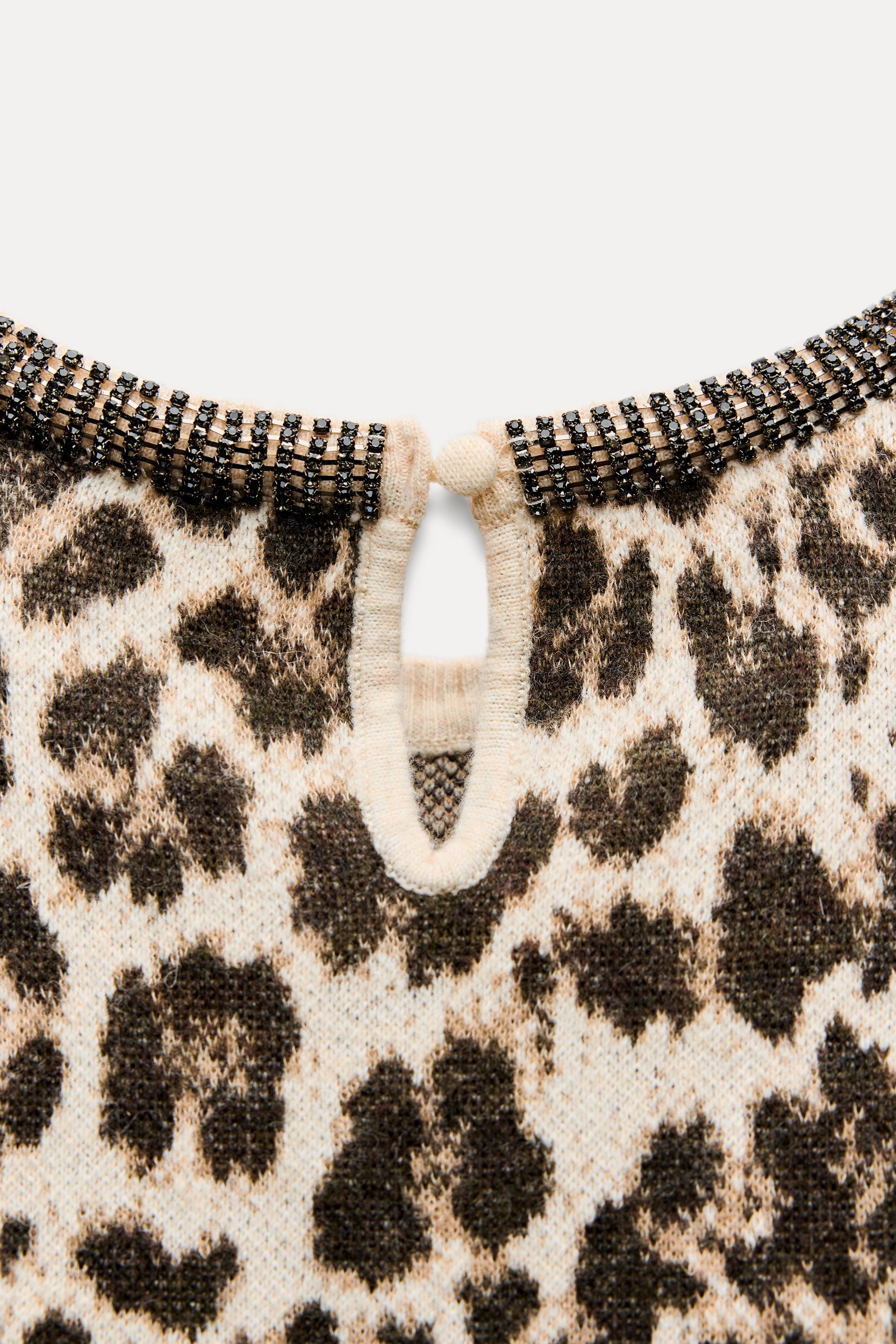 JACQUARD KNIT ANIMAL PRINT JEWELED NECKLINE TOP Product Image