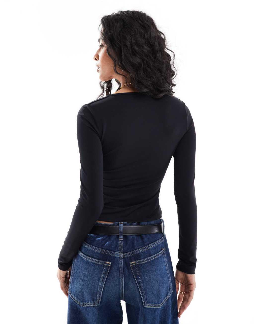 ASOS DESIGN contrast bust long sleeve top in black Product Image