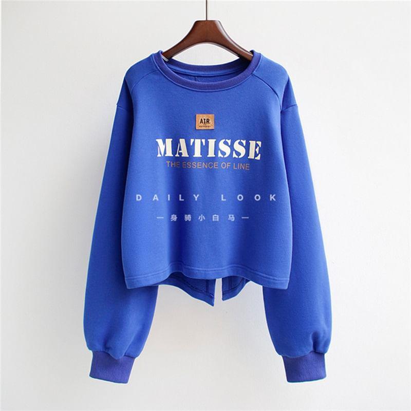 Raglan-Sleeve Crew Neck Lettering Asymmetrical Cropped Sweatshirt Product Image