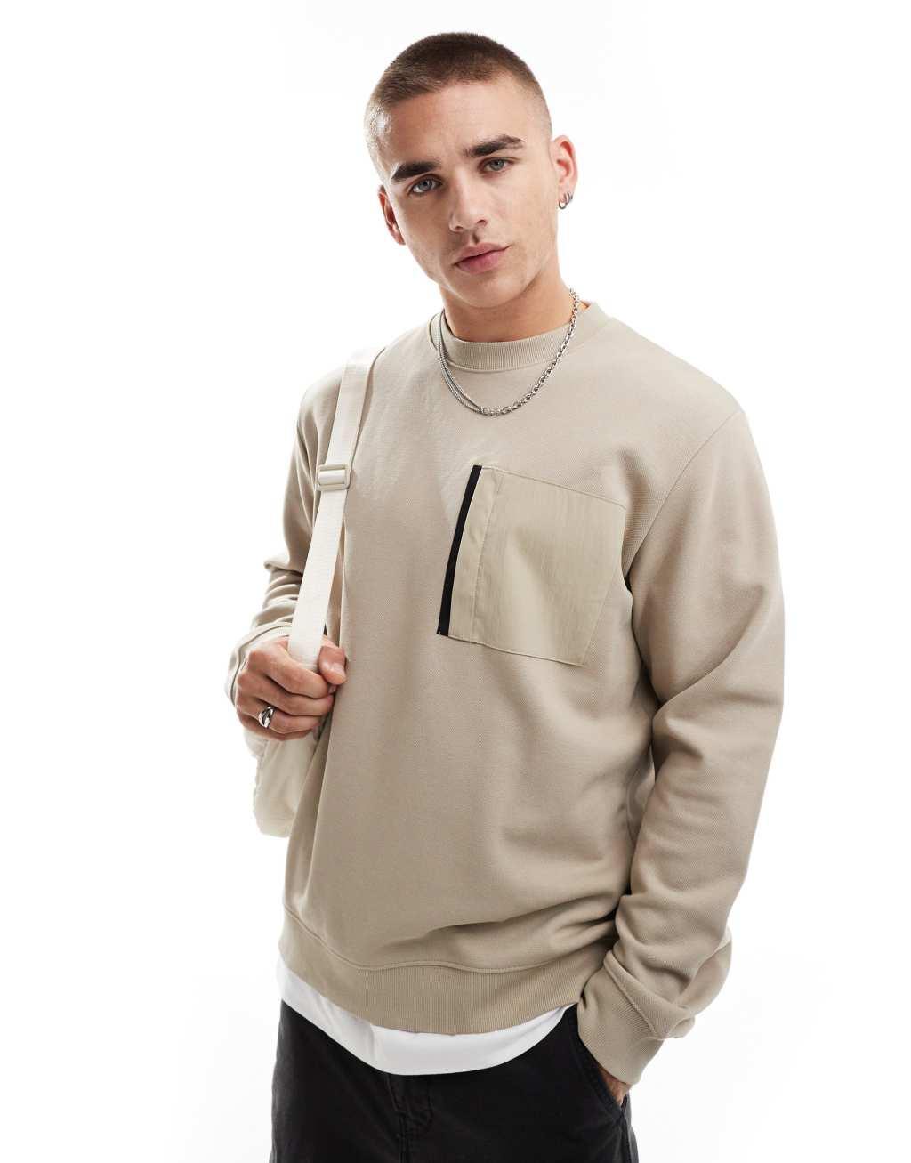 Jack & Jones oversized washed crew neck sweatshirt with nylon pocket in beige Product Image