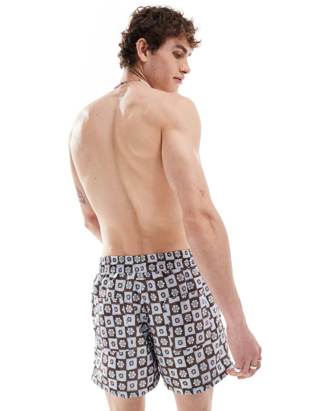 Reclaimed Vintage swim shorts in blue floral tile print Product Image