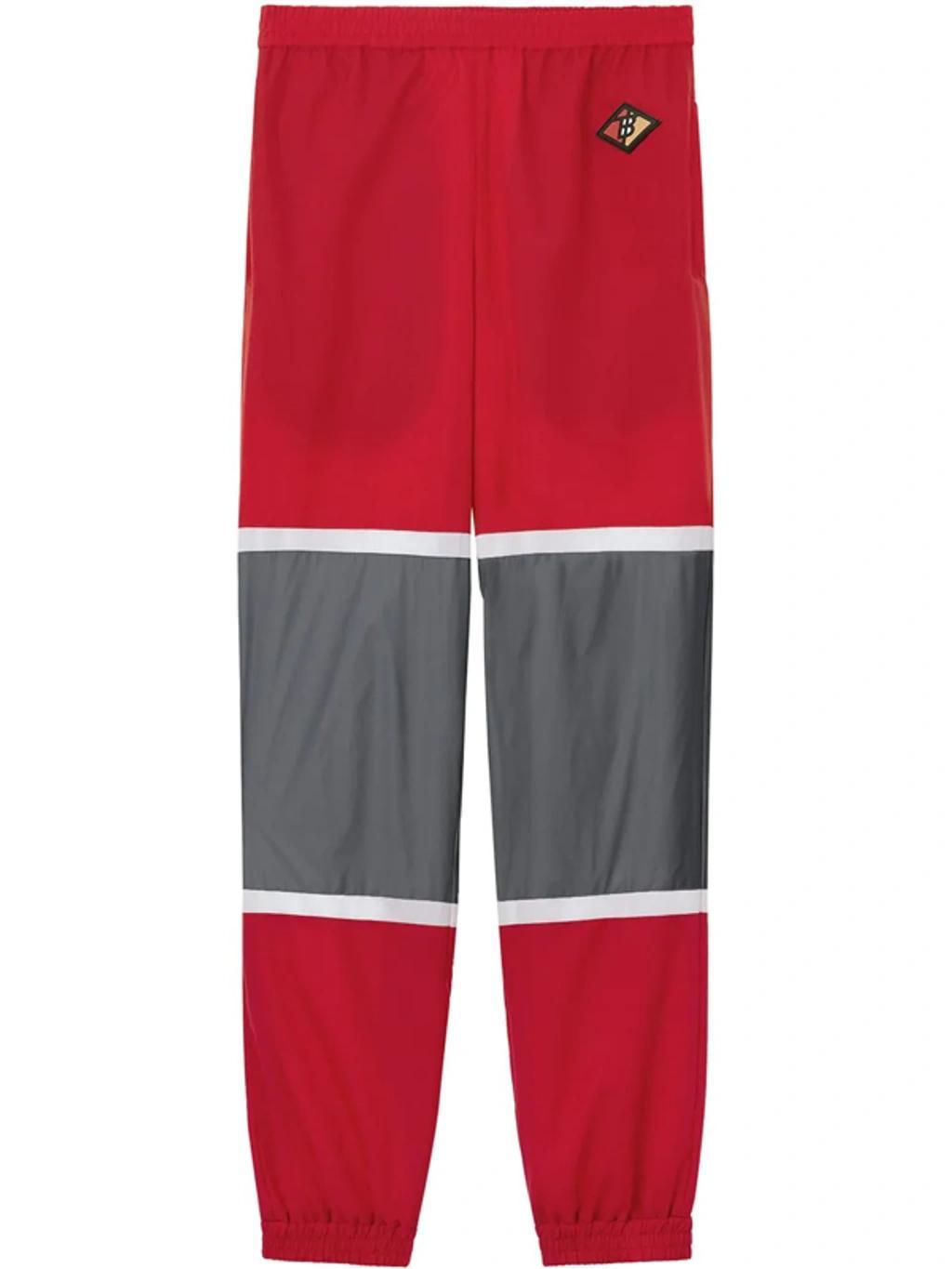 BURBERRY Logo Graphic Striped Nylon Trackpants In Red Product Image