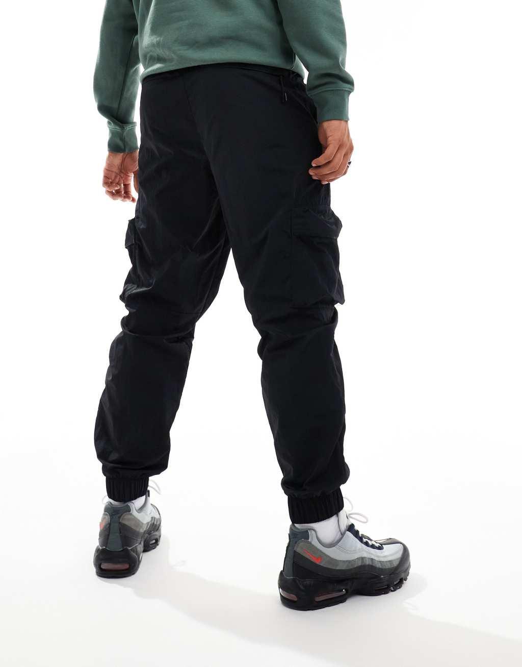 Nike Tech woven cargo pants in black Product Image