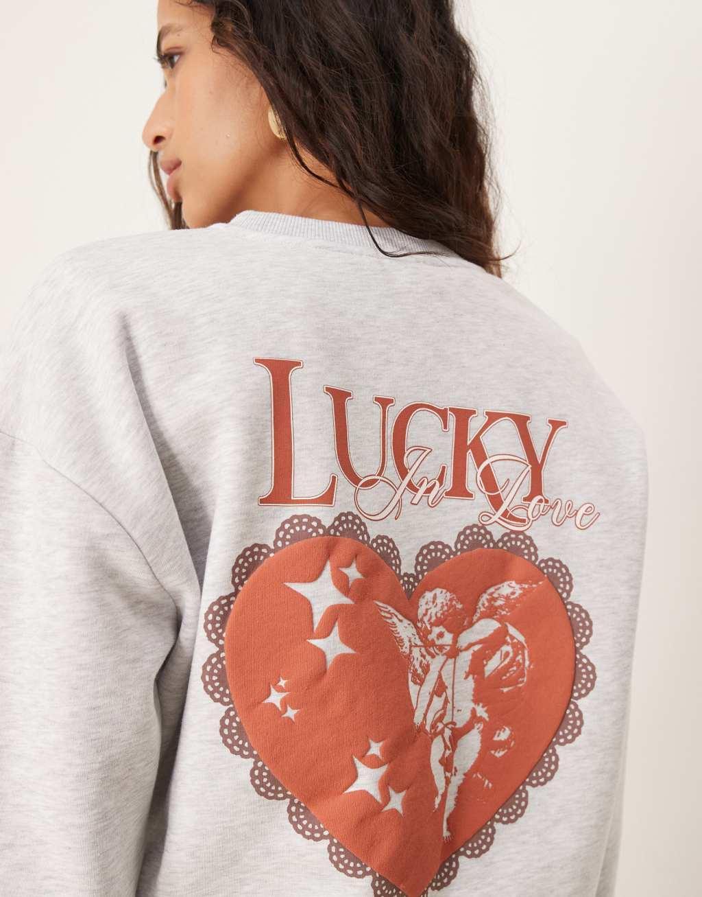 ASOS DESIGN oversized sweatshirt with lucky in love cherub graphic in heather gray Product Image