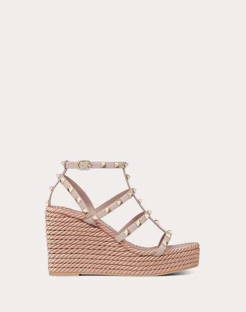 ROCKSTUD ANKLE STRAP WEDGE SANDAL IN CALFSKIN LEATHER 95 MM Product Image