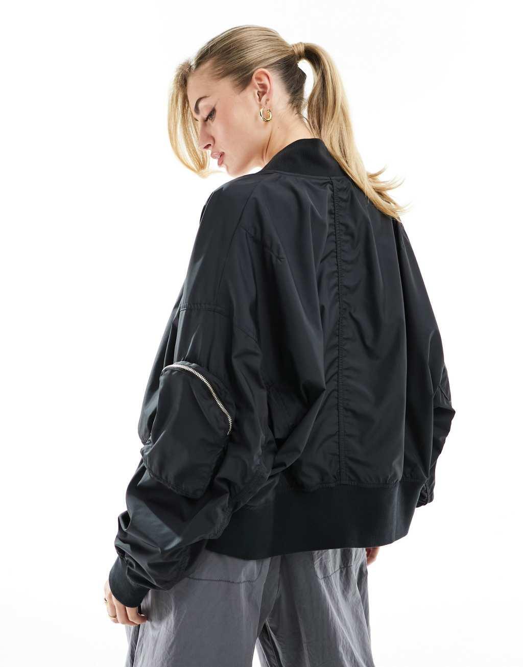 Nike essenitals oversized bomber jacket in black  Product Image