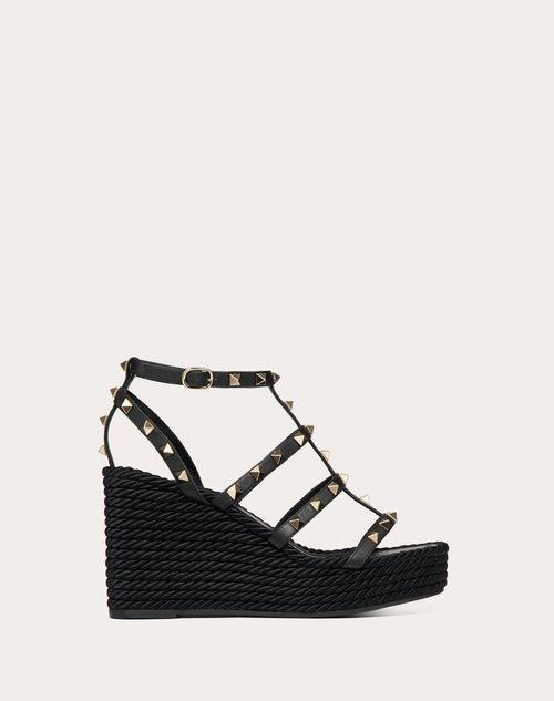 ROCKSTUD ANKLE STRAP WEDGE SANDAL IN CALFSKIN LEATHER 95 MM Product Image