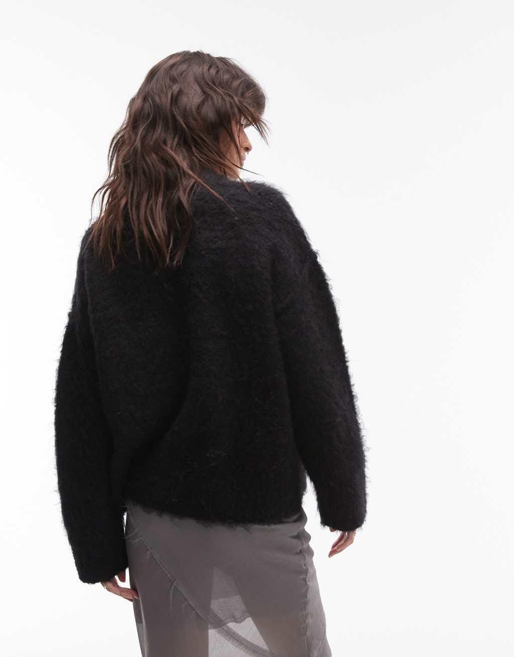 Topshop knitted fluffy relaxed sweater in black Product Image