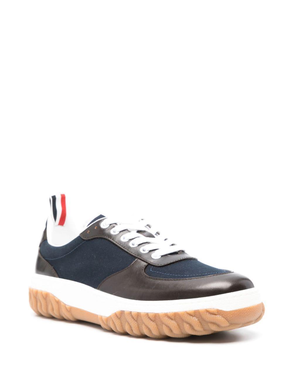 Letterman Panelled Sneakers In Navy Blue Product Image