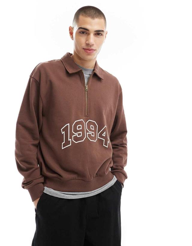 ASOS DESIGN boxy oversized polo sweatshirt with print and tipping detail in brown Product Image