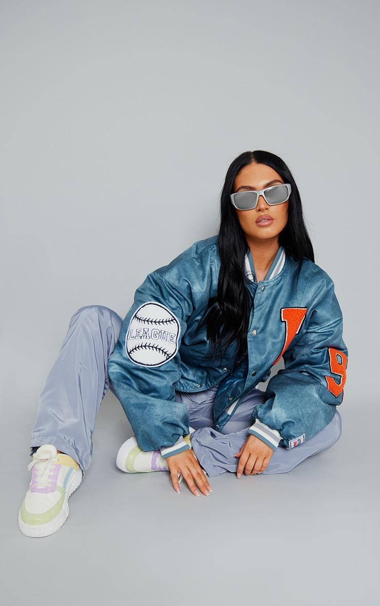 PRETTYLITTLETHING Blue Graphic Back Brushed Look Satin Bomber Jacket Product Image