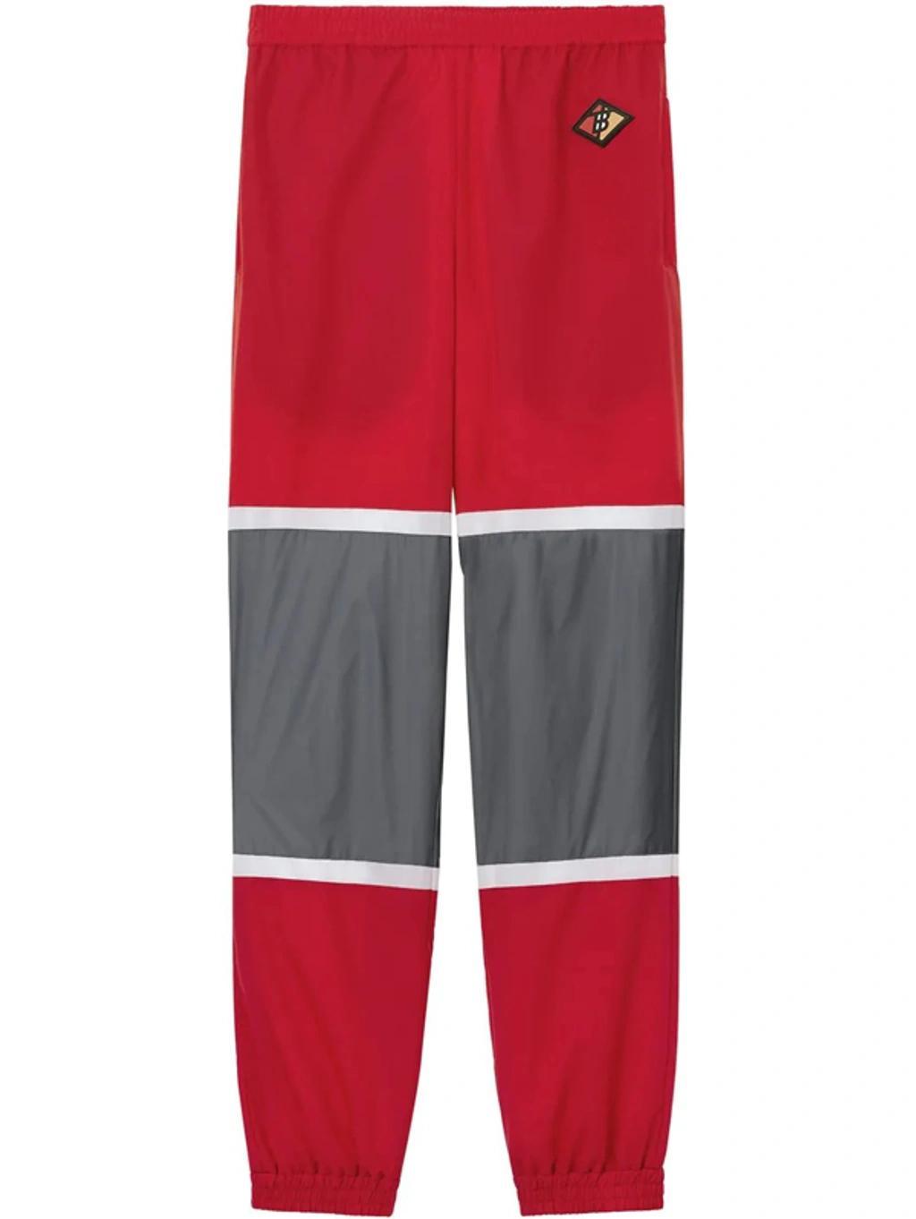 BURBERRY Logo Graphic Striped Nylon Trackpants In Red Product Image