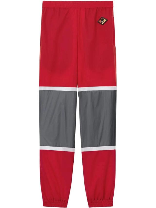 BURBERRY Logo Graphic Striped Nylon Trackpants In Red Product Image