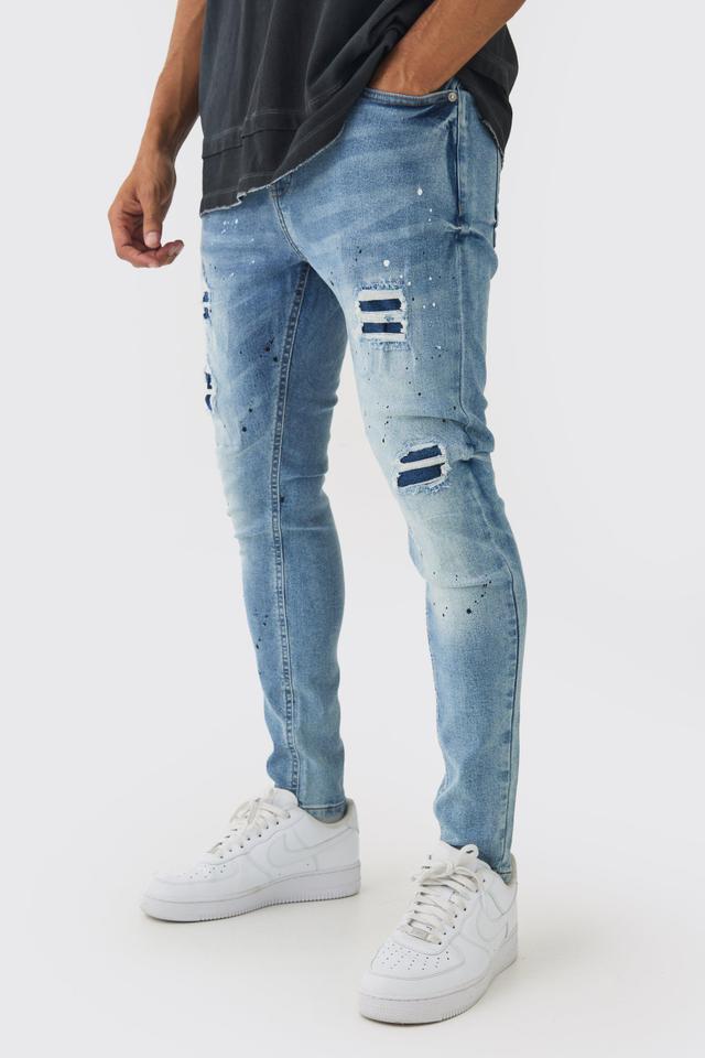 Skinny Fit Rip & Repair Paint Splatter Jeans | boohooMAN USA Product Image