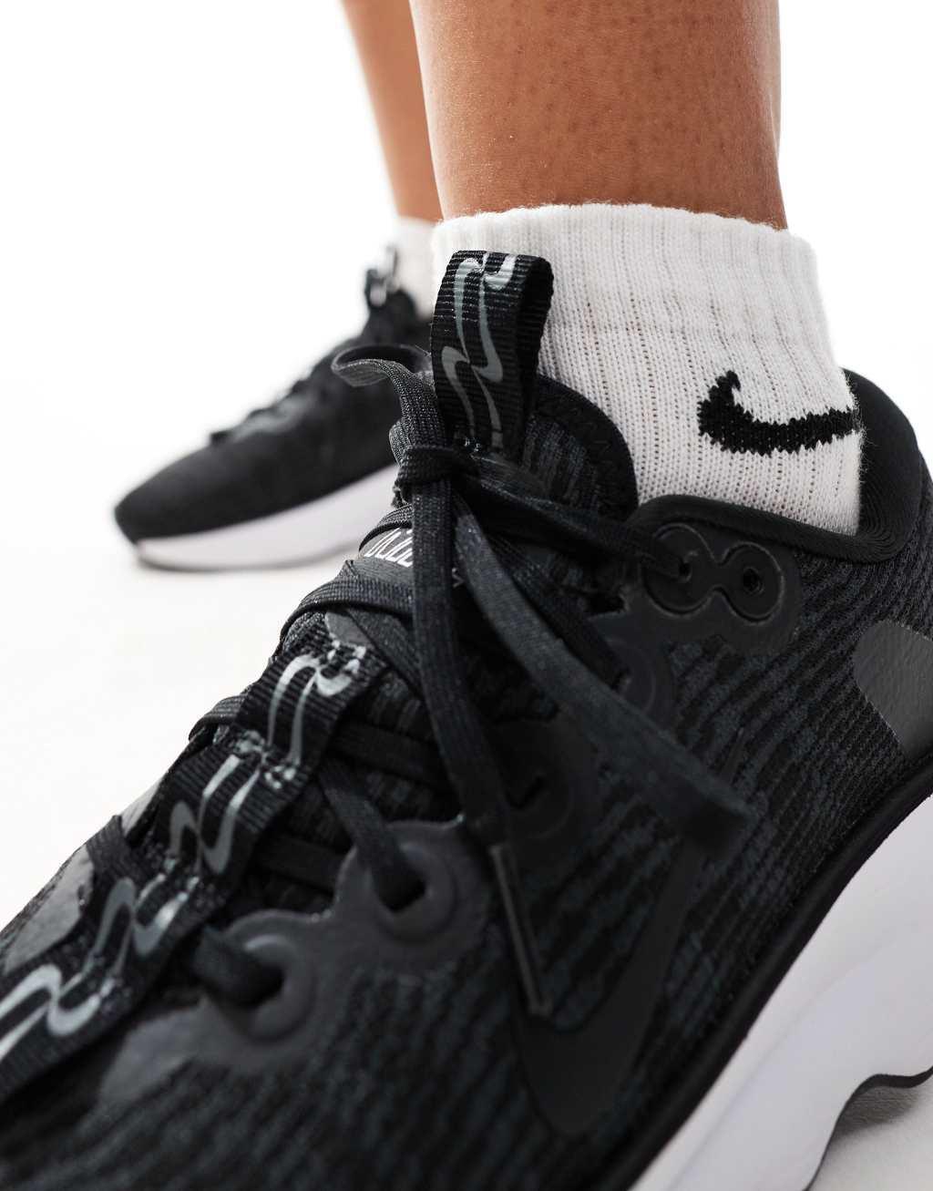 Nike Training Motiva sneakers in black and white Product Image