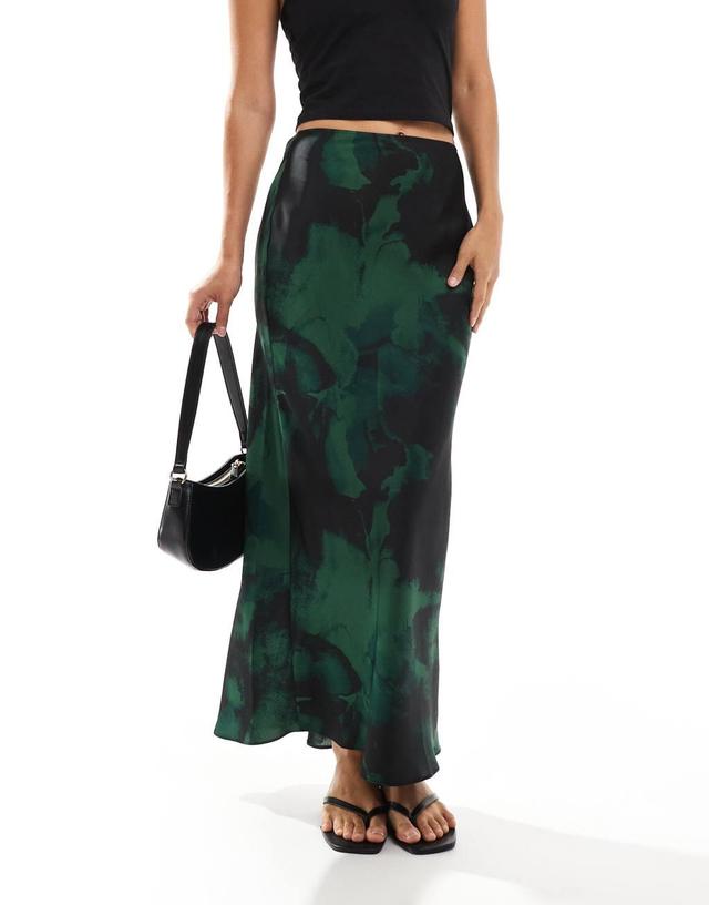 ASOS DESIGN satin bias cut midi skirt in green & black blurred floral Product Image