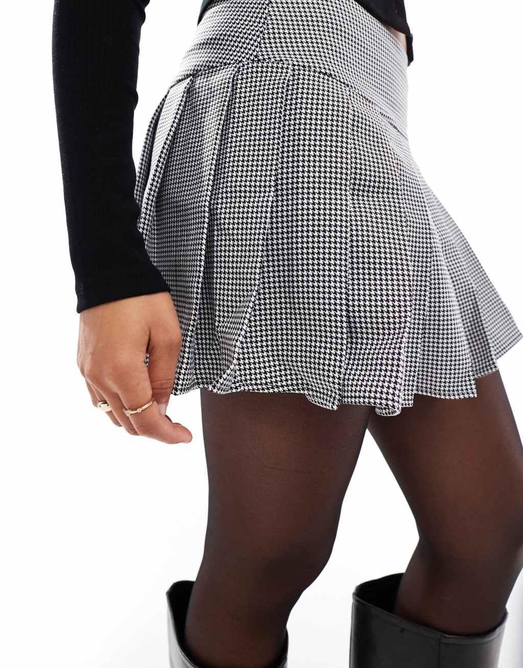 ASOS DESIGN pleated mini skirt in black & white plaid Product Image