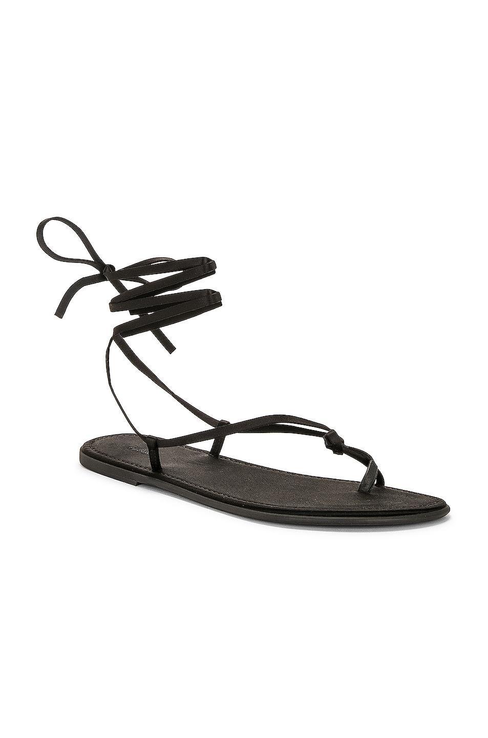 The Row Knot Flat Sandal in Black - Black. Size 36 (also in ). Product Image