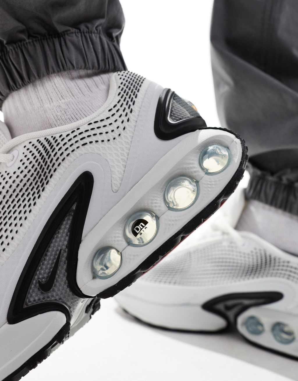 Nike Air Max DN sneakers in white and black Product Image