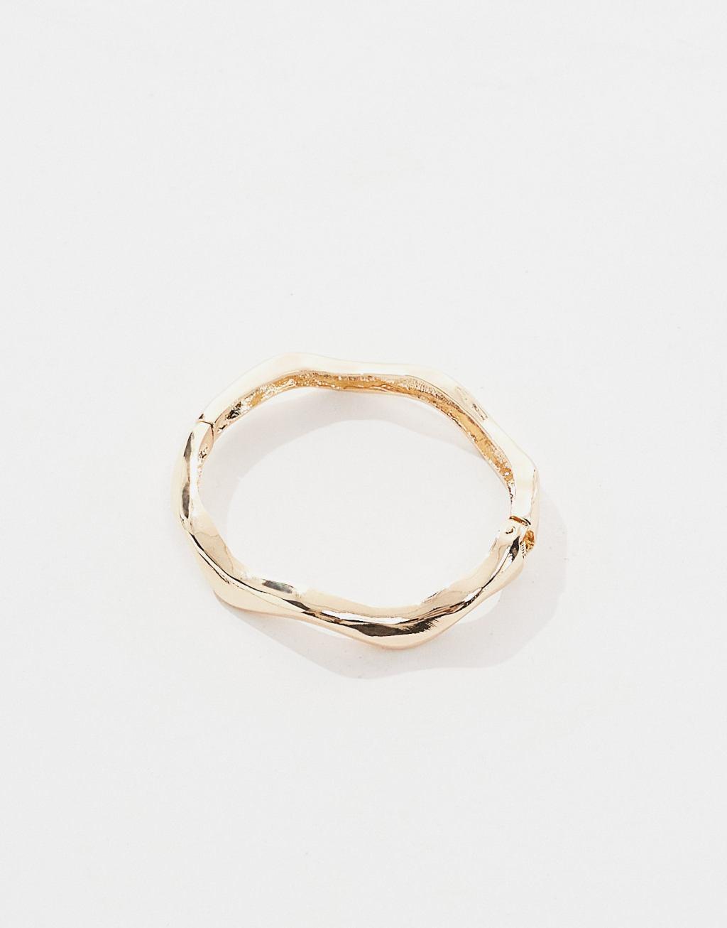 ASOS DESIGN Curve bangle bracelet with wave detail in gold tone Product Image