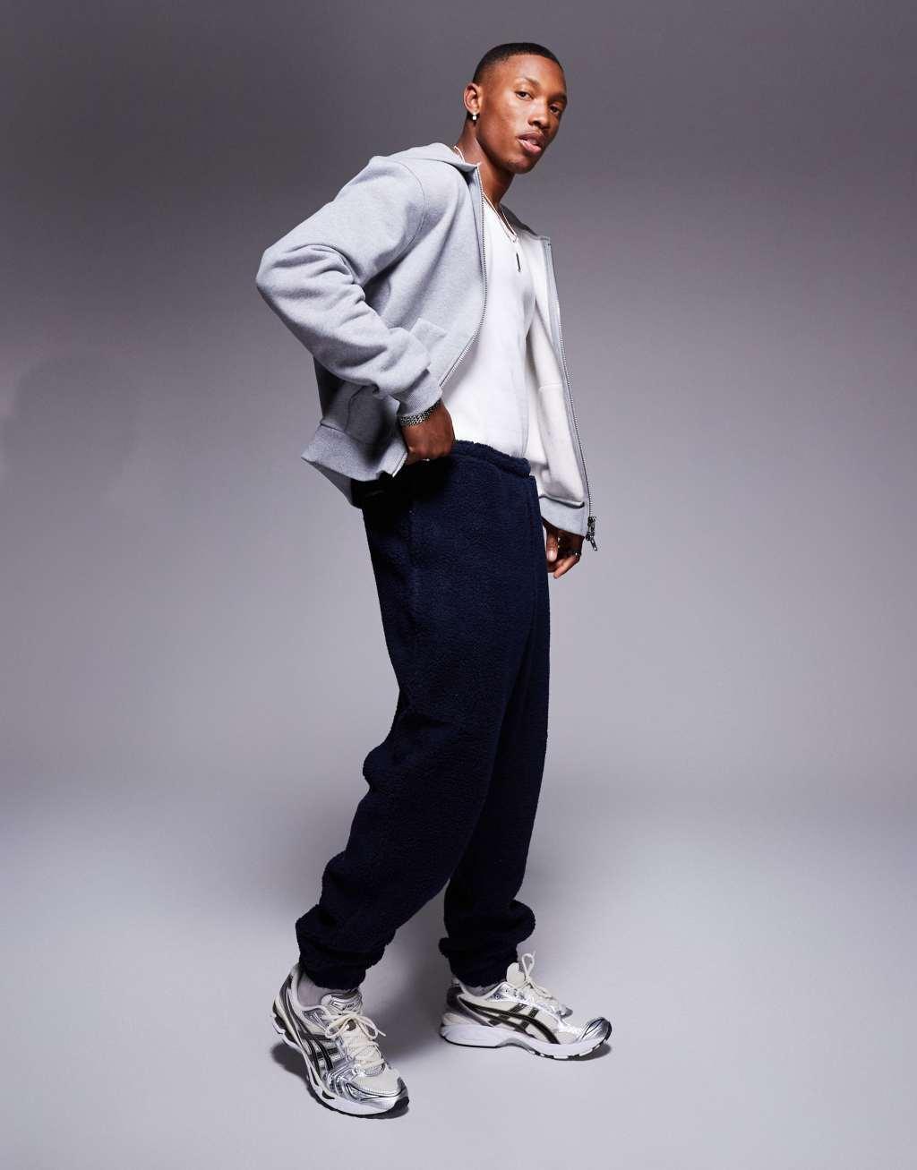 ASOS DESIGN oversized borg sweatpants in navy Product Image