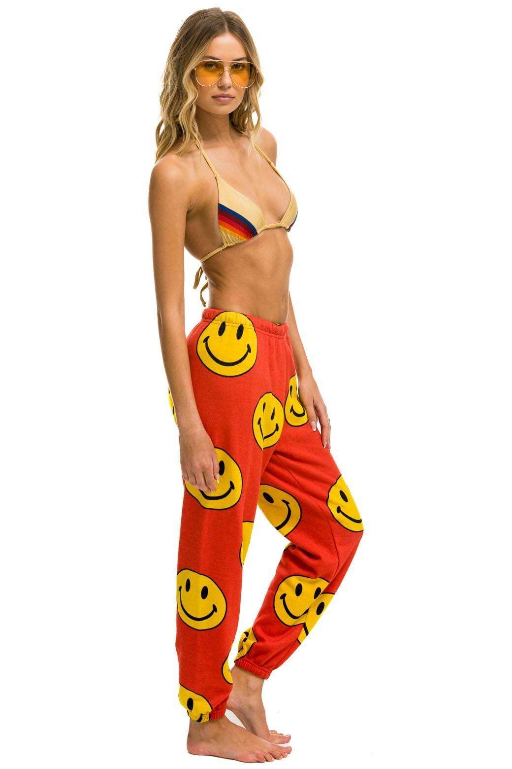 SMILEY REPEAT SWEATPANTS - RED Female Product Image