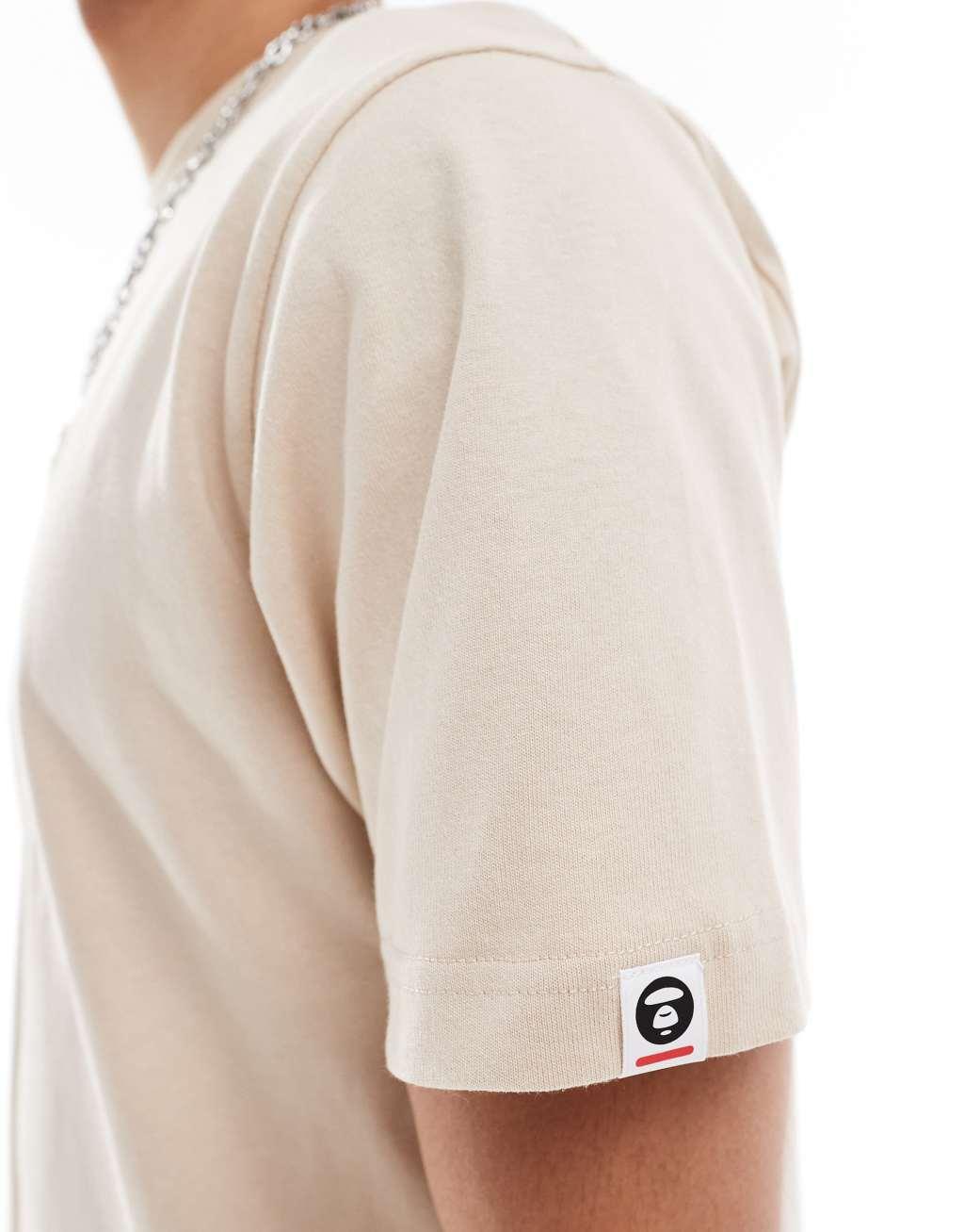 Aape By A Bathing Ape regular fit short sleeve T-shirt in beige Product Image