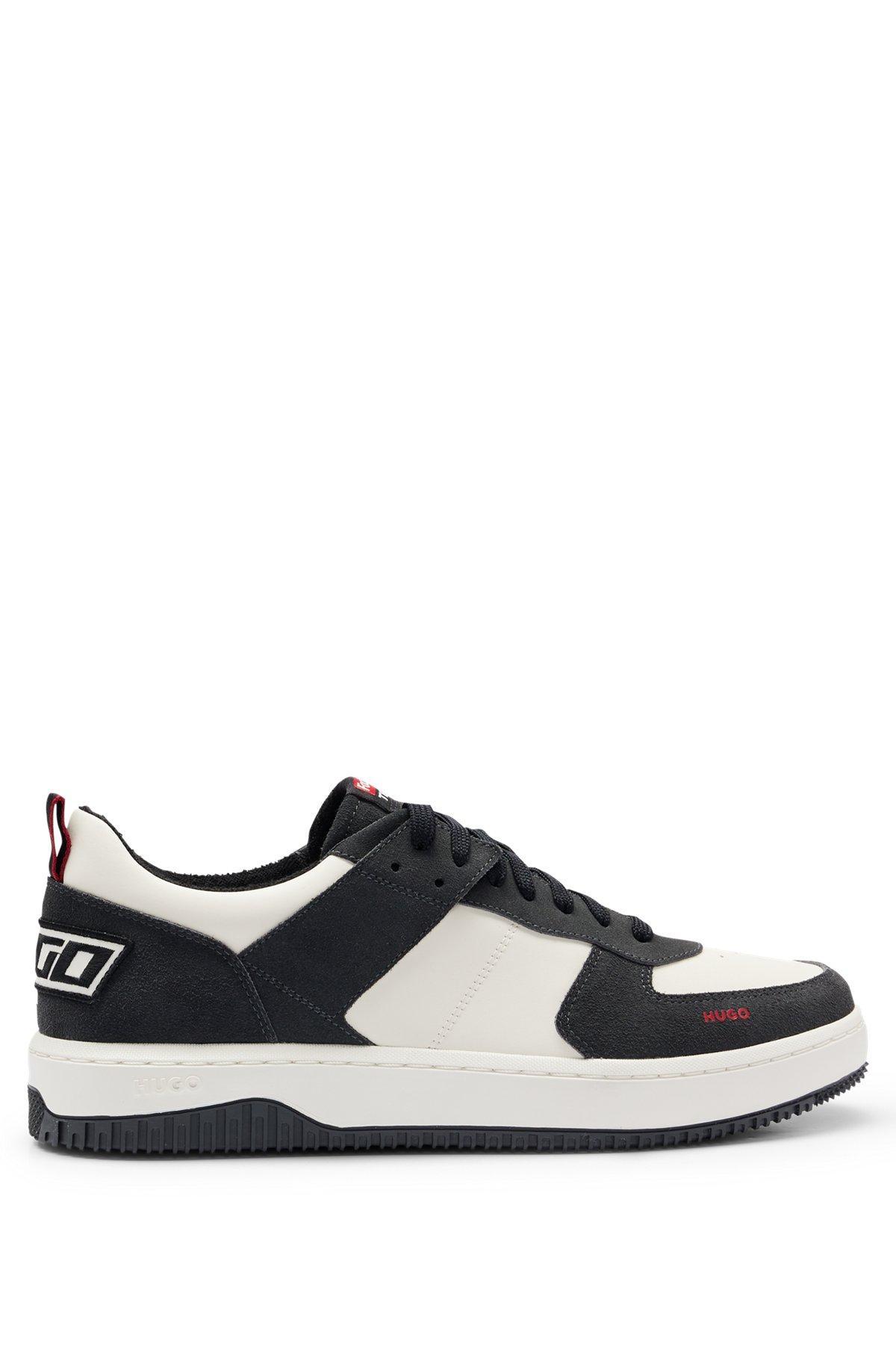 Low-top trainers in faux leather and suede Product Image