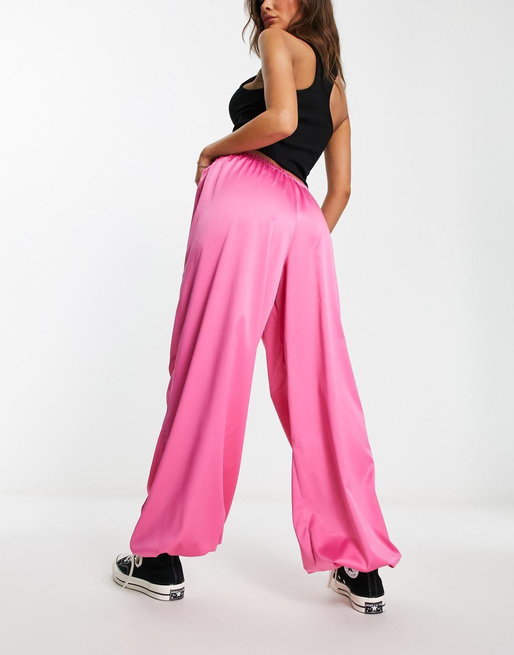 ASOS DESIGN satin parachute pants in pink Product Image