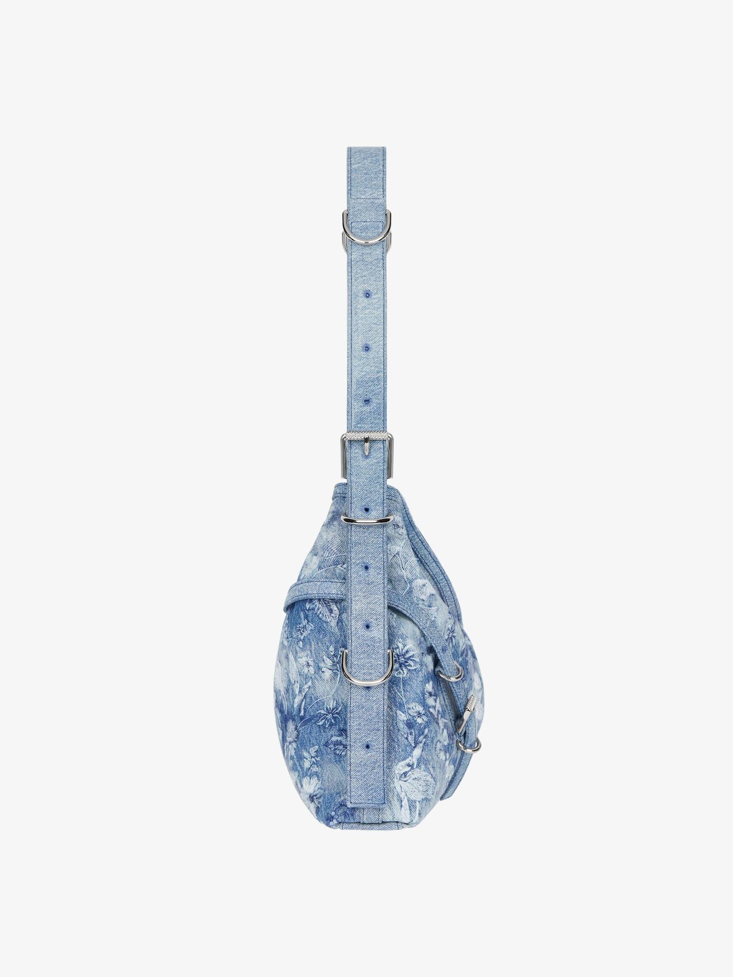 Medium Voyou bag in washed embroidered denim Product Image