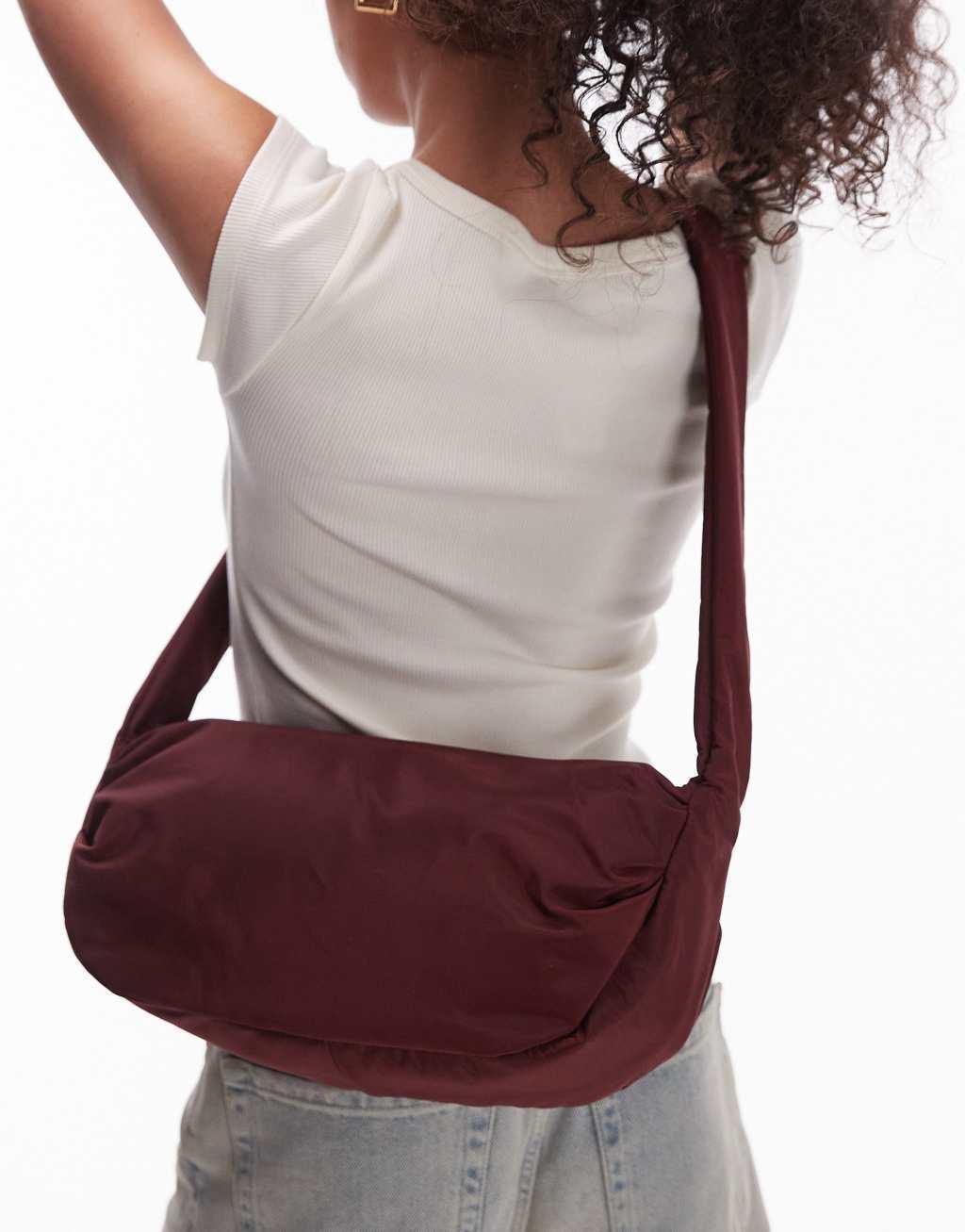 Topshop Con nylon cross body bag in burgundy Product Image