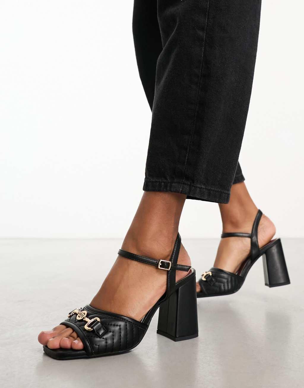 River Island block heel with hold buckle detail in black Product Image