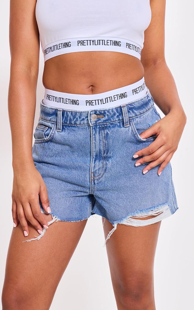 PRETTYLITTLETHING Mid Blue Wash Distressed High Rise Mom Denim Shorts Product Image