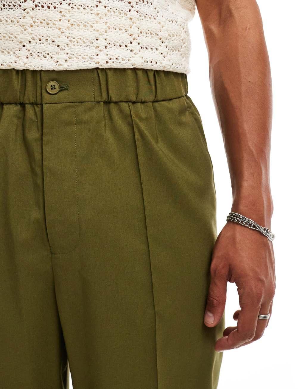 ASOS DESIGN pull on smart wide leg elasticated waistband pants in green Product Image