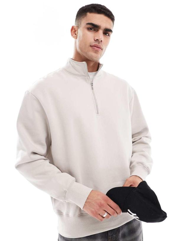 ASOS DESIGN premium heavyweight oversized quarter zip sweatshirt 400gsm in beige Product Image