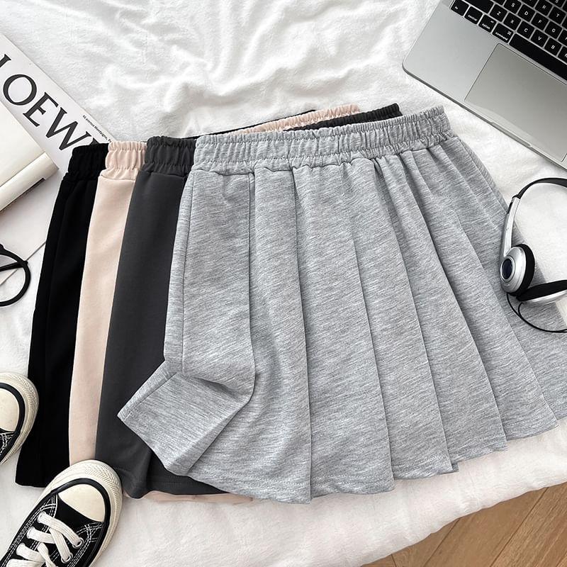 Set: Off Shoulder Lettering Print Crop Sweatshirt + Mini Pleated Skirt Product Image