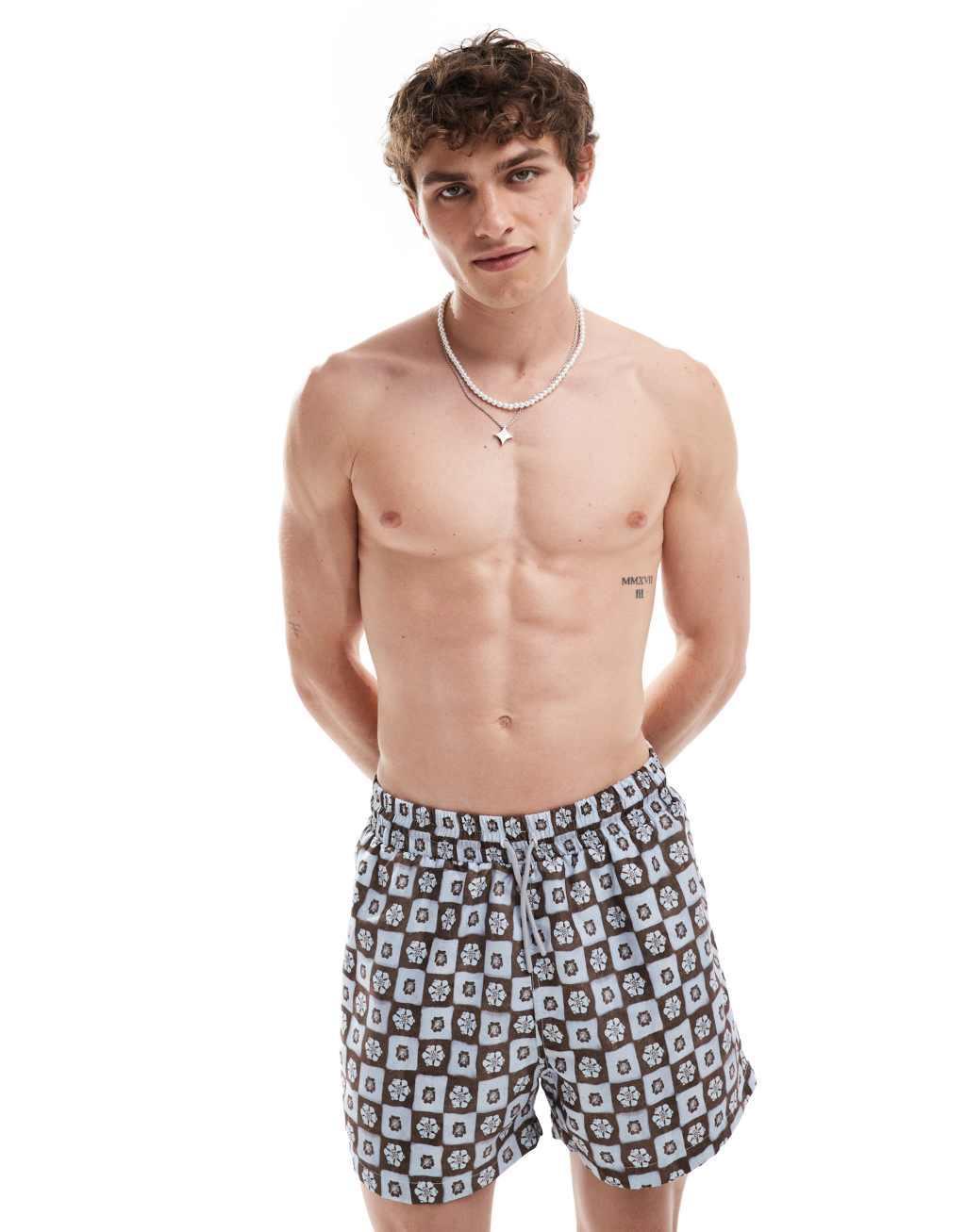 Reclaimed Vintage swim shorts in blue floral tile print Product Image