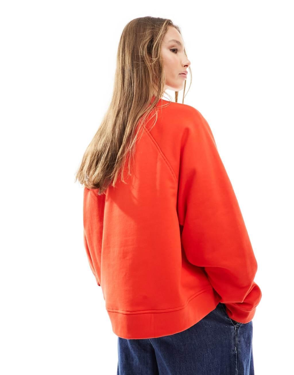 ASOS DESIGN oversized sweatshirt with raglan detail in red Product Image