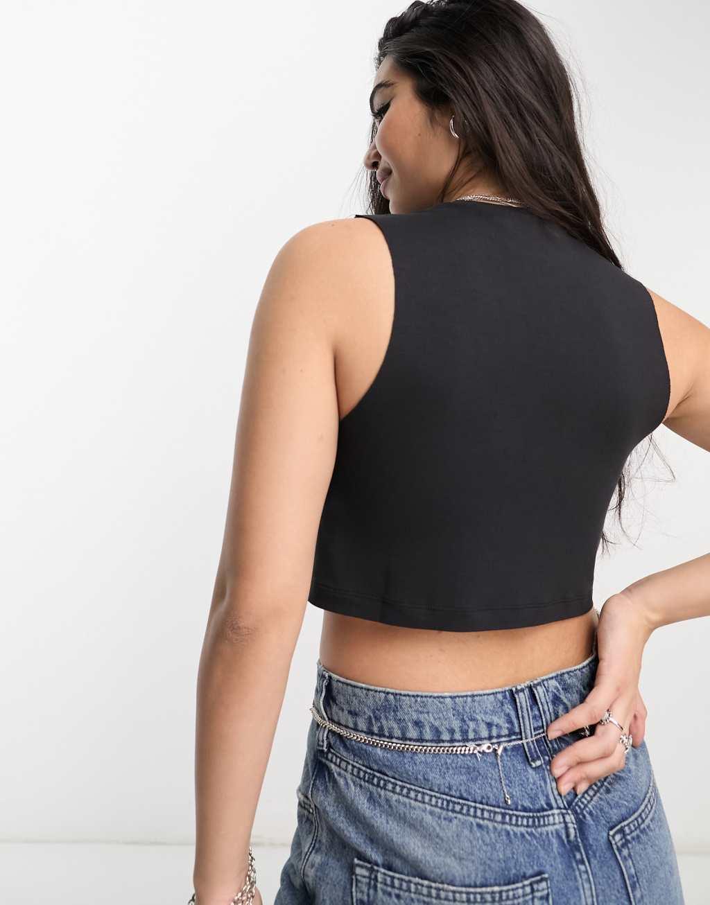 ASOS DESIGN dropped arm hole raw edge tank top in black Product Image