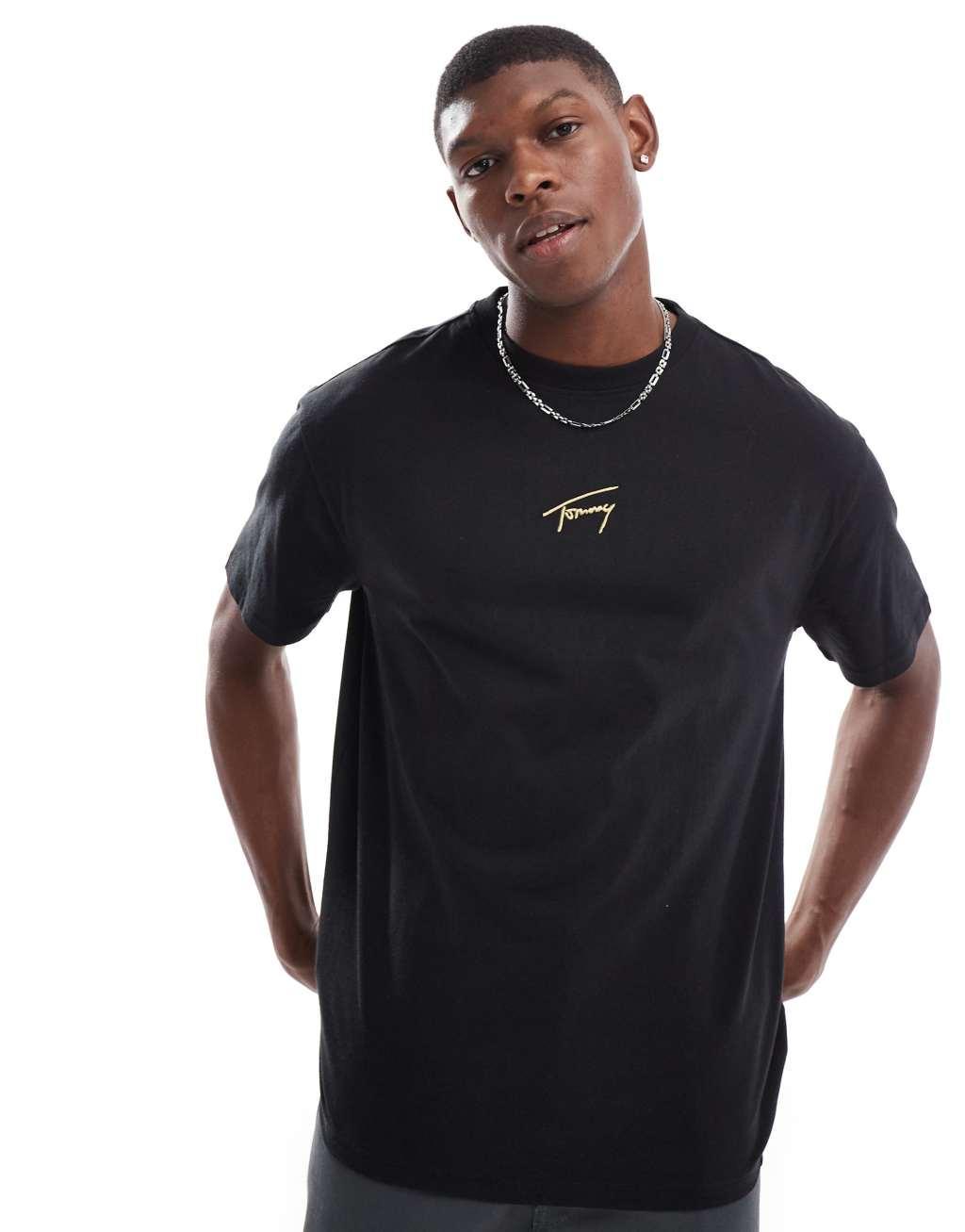 Tommy Jeans gold central logo t-shirt in black Product Image