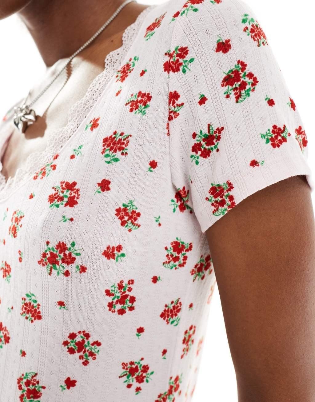 Monki pointelle top with scoop neck and lace trim in pink and red floral print Product Image