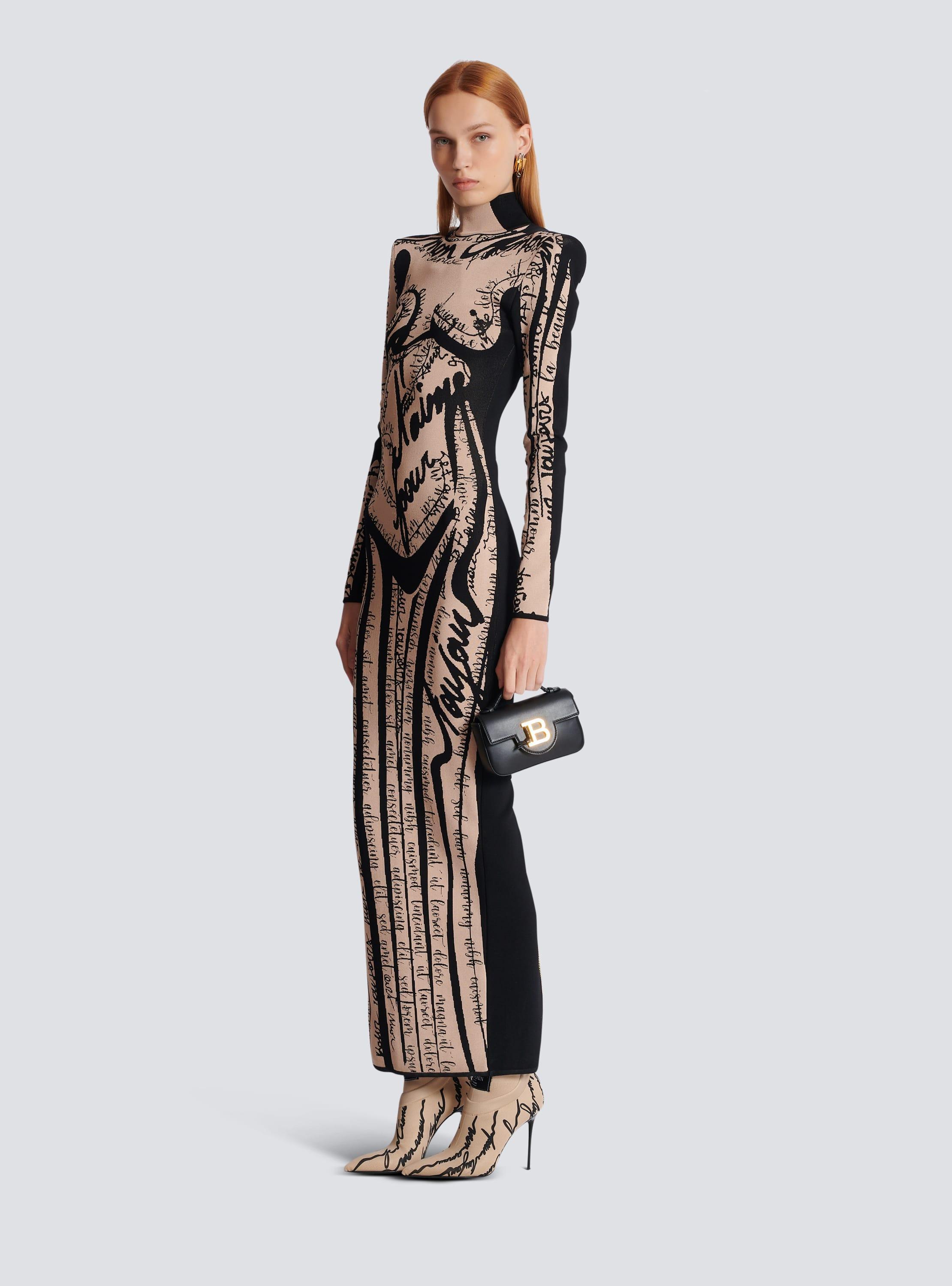 Long knit dress with body motif Product Image