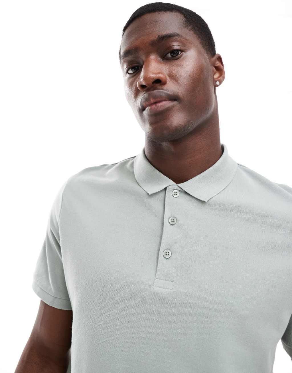 ASOS DESIGN pique polo in light green Product Image